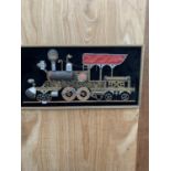 A GILT FRAMED SCRATCH BUILT IMAGE OF A TRAIN USING VARIOUS VINTAGE ITEMS