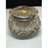 A CUT GLASS POT WITH A HALLMARKED BIRMINGHAM SILVER PIERCED LID