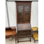 AN EARLY 20TH CENTURY OAK BUREAU BOOKCASE WITH GLAZED AND LEADED UPPER PORTION, 33" WIDE