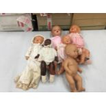 A COLLECTION OF SIX VINTAGE DOLLS, FOUR WITH ELASTIC JOINTED LIMBS, ONE WITH A CLOTH BODY AND