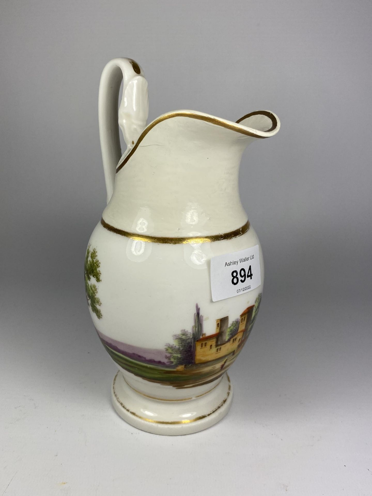 A 19TH CENTURY PORCELAIN JUG WITH HAND PAINTED MANOR HOUSE DESIGN