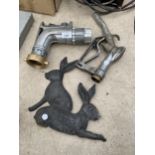 A PETROL PUMP, A SCULLY SCULFLOW NOZZLE AND A METAL PLAQUE OF TWO RABBITS