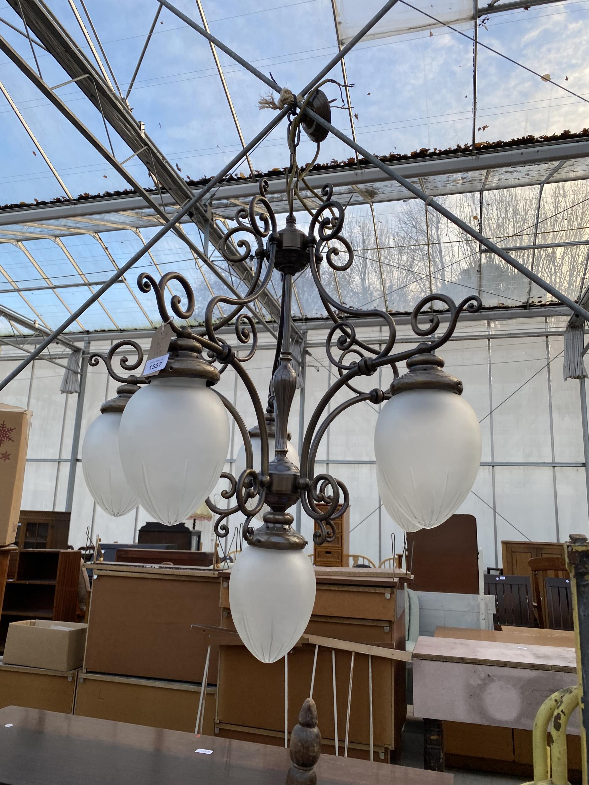 A FIVE BRANCH CEILING LIGHT FITTING WITH GLASS SHADES