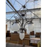 A FIVE BRANCH CEILING LIGHT FITTING WITH GLASS SHADES