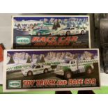 TWO BOXED HESS SETS TO INCLUDE A RACE CAR AND A RACER AND A TOY TRUCK AND RACE CAR