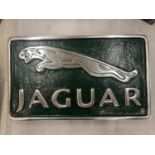 A GREEN AND CHROME JAGUAR SIGN 29CM X 17CM