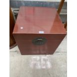 A CHINESE RED LAQUERED STORAGE BOX, 17.5" WIDE