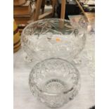 A LARGE CUT GLASS CRYSTAL FOOTED BOWL AND A SMALLER BOWL