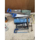AN ASSORTMENT OF TOOLS AND HARDWARE TO INCLUDE A LARGE G CLAMP, THREE WOOD SAWS AND TWO BOXES OF