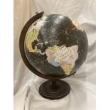 A VINTAGE STYLE GLOBE ON A WOODEN BASE