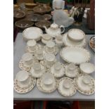 A CHINA DINNER SERVICE TO INCLUDE A TEAPOT, CREAM AND MILK JUGS, SUGAR BOL, PLATES, BOWLS, CUPS,