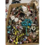 A LARGE QUANTITY OF COSTUME JEWELLERY TO INCLUDE BEADS, NECKLACES, WATCHES, BANGLES, BRACELETS, ETC