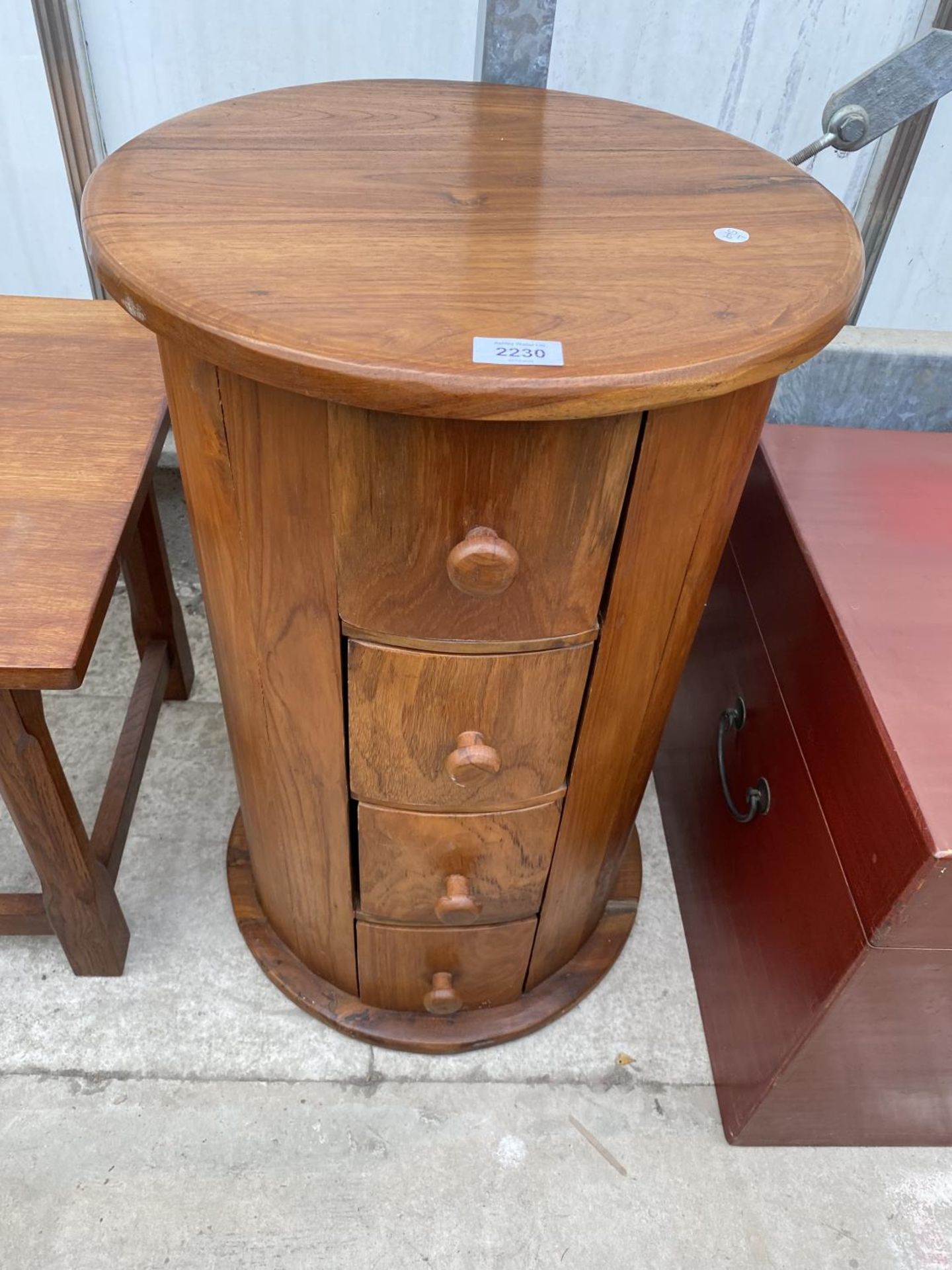 A 17" DIAMETER HARDWOOD CHEST OF THREE DRAWERS