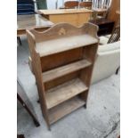 A MID 20TH CENTURY OAK OPEN BOOKCASE