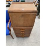 A MID 20TH CENTURY OAK BUREAU 20 INCHES WIDE