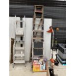 AN ASSORTMENT OF LADDERS TO INCLUDE A WOODEN STEP LADDER, TWO TUBULAR METAL STEP LADDERS AND A RES-