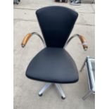 A RETRO SWIVEL FAUX BLACK LEATHER OFFICE CHAIR WITH SWEPT ARMS ON POLISHED CHROME AND ALLOW FRAME