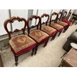 A SET OF SIX VICTORIAN MAHOGANY DINING CHAIRS ON TURNED AND FLUTED LEGS