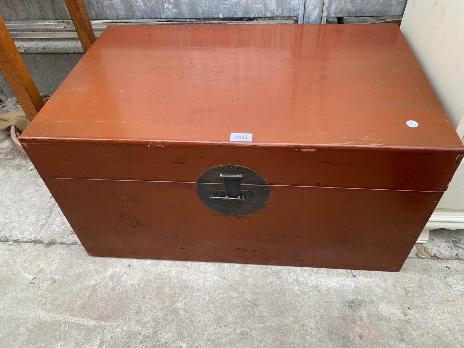 A CHINESE RED LAQUERED STORAGE BOX, 30.5" WIDE