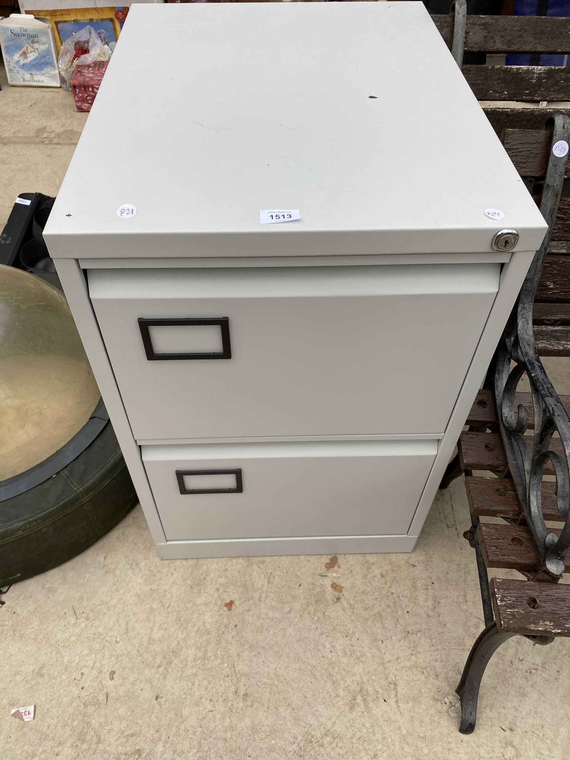 A TWO DRAWER METAL FILING CABINET