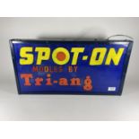 AN ILLUMINATED "SPOT-ON MODELS BY TRI-ANG" SIGN (LENGTH 57CM, HEIGHT 29CM, DEPTH 10CM)