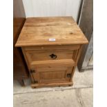 A MEXICAN PINE BEDSIDE CHEST