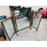 A THREE SECTION FOLDING DRESSING TABLE MIRROR