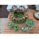 AN ASSORTMENT OF GREEN GLASS WARE TO INCLUDE SHERRY GLASSES AND A DRESSING TABLE SET ETC