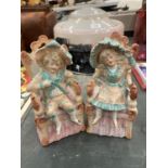 A PAIR OF BISQUE CONTINENTAL SEATED FIGURES