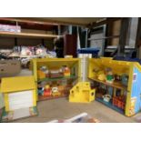 A FISHER PRICE FAMILY PLAY HOUSE WITH PEOPLE AND FURNITURE