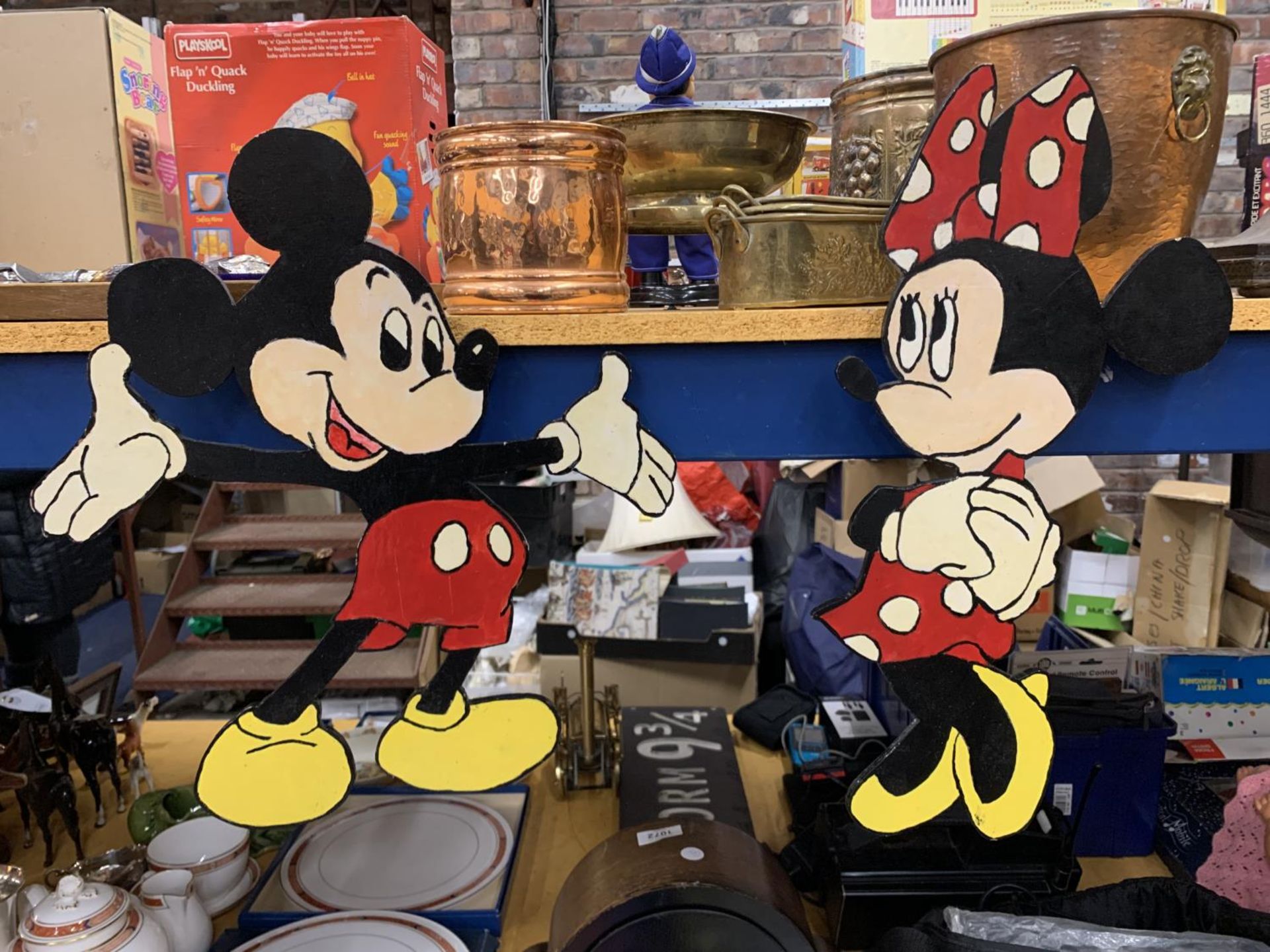 A MICKEY AND MINNIE MOUSE WOODEN WALL HANGINGS