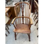 A 19TH CENTURY ELM AND ASH WINDSOR ARMCHAIR WITH HIGH BACK AND CRINOLIN BOW