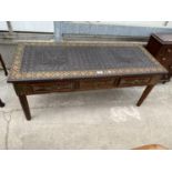 AN EASTERN HARDWOOD CARVED AND STUDDED COFFEE TABLE WITH THREE DRAWERS HAVING BRASS HANDLES, 42X17"