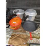 TWO STAINLESS STEEL PRESSURE COOKERS, A LE CRUESET SKILLET PAN AND A FURTHER CAST IRON COOKING POT