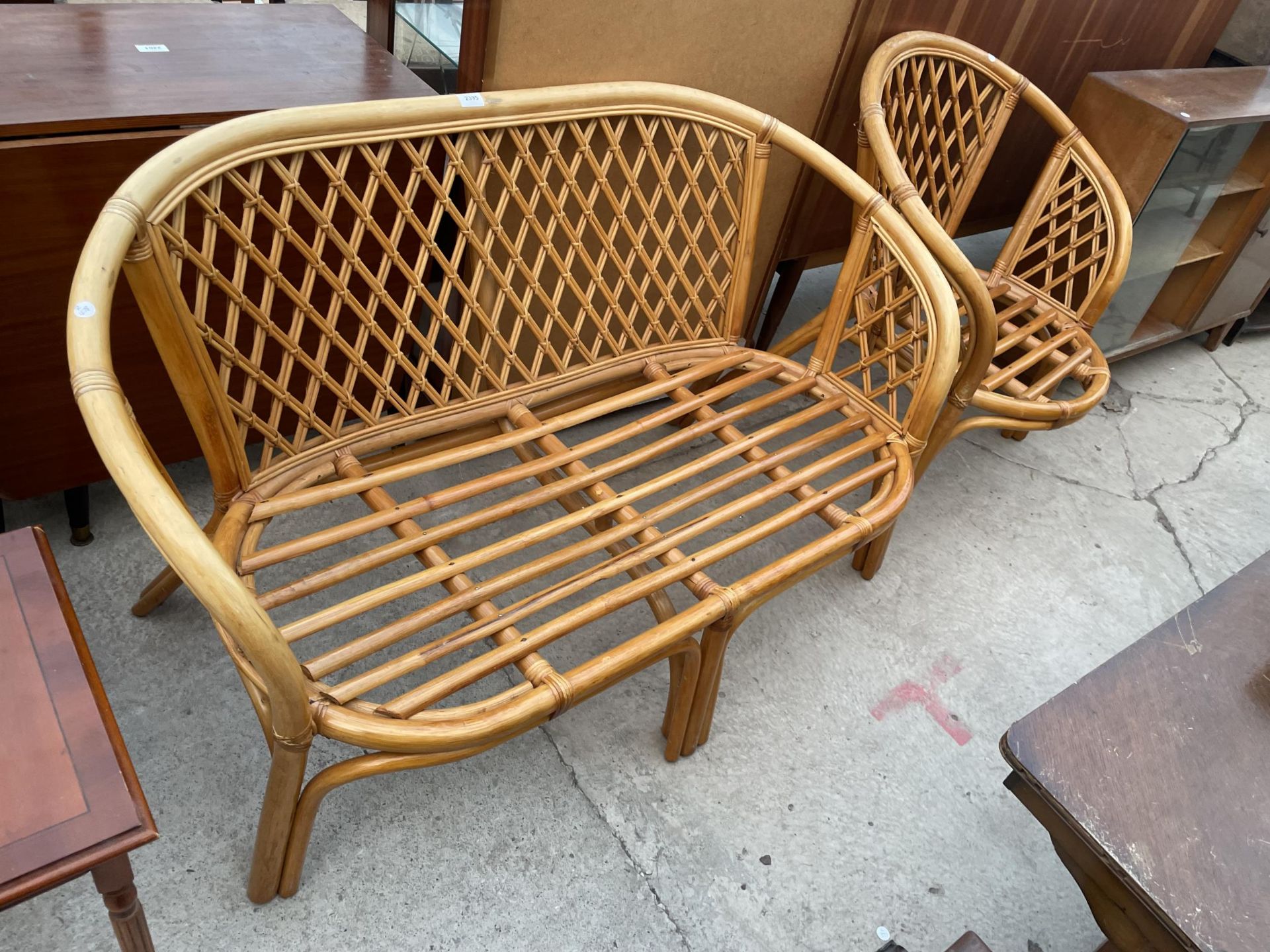 A WICKER AND BAMBOO SETTLE AND CHAIR, LACKING CUSHIONS