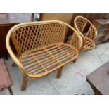 A WICKER AND BAMBOO SETTLE AND CHAIR, LACKING CUSHIONS