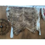 A LARGE ANIMAL HIDE RUG