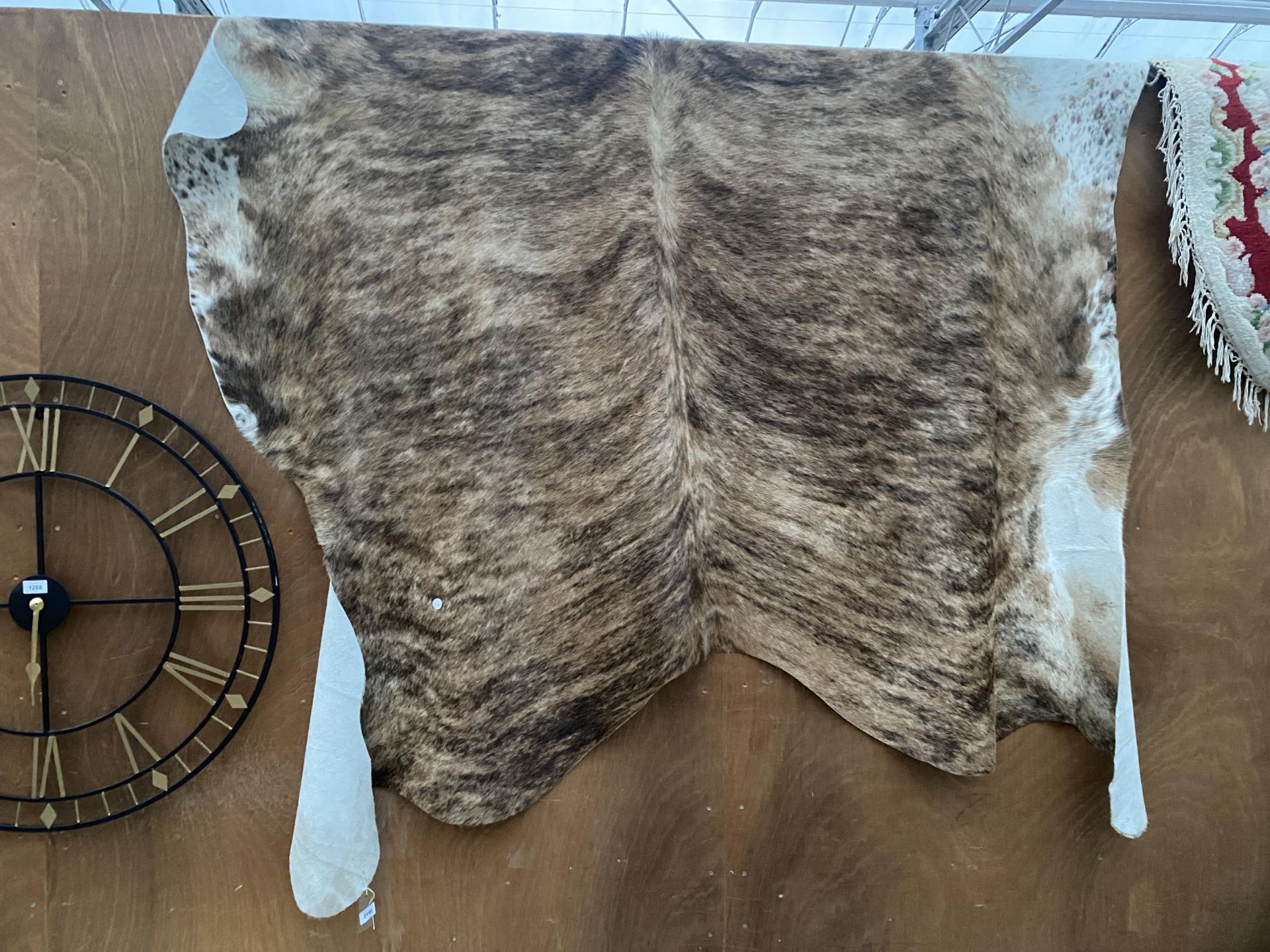 A LARGE ANIMAL HIDE RUG