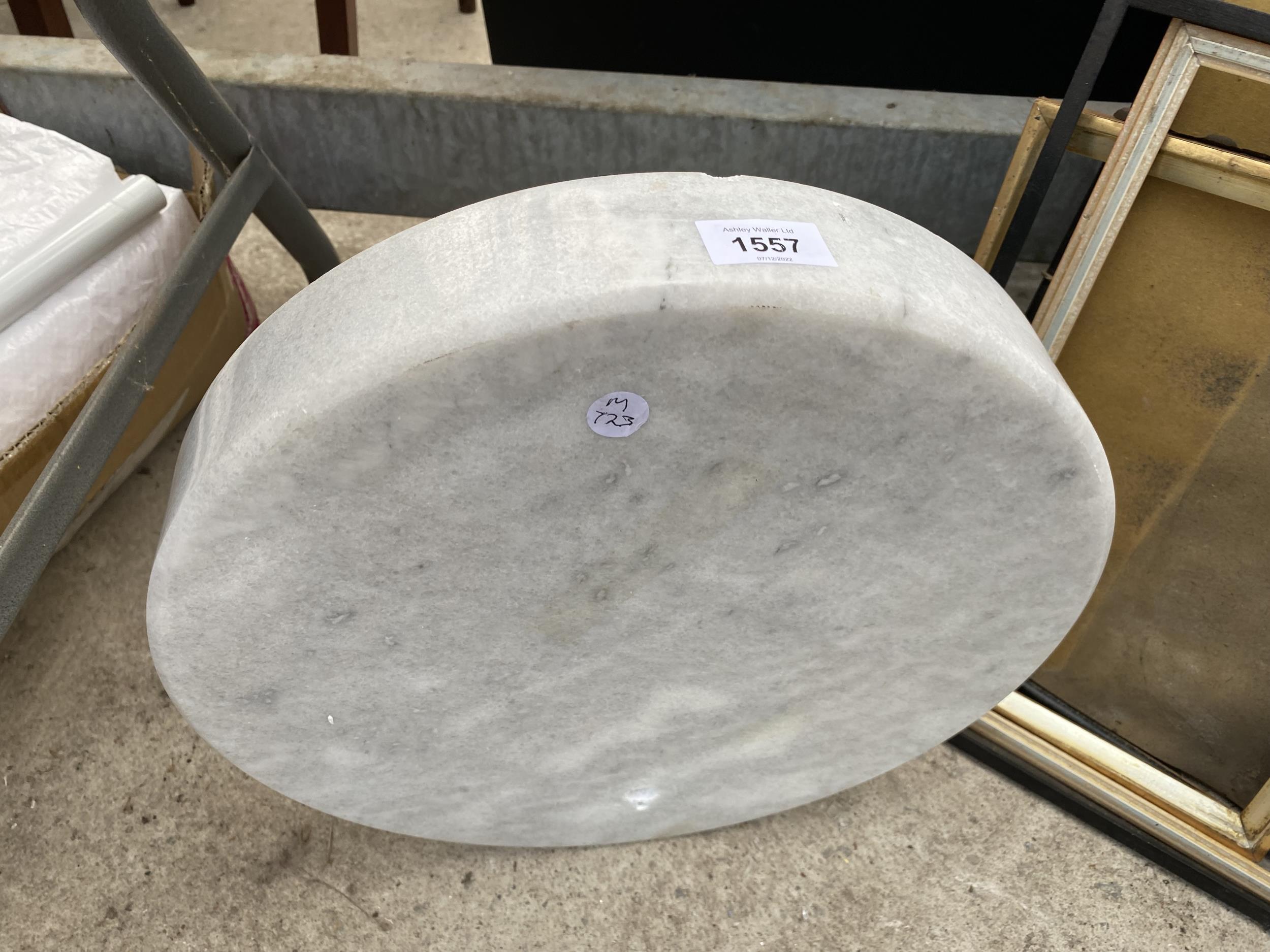 A PIECE OF CIRCULAR MARBLE