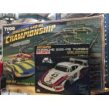 TWO BOXED ITEMS TO INCLUDE A TYCO MAGNUM 440 X2 CHAMPIONSHIP AND AN ATCOMI RADIO CONTROLLED CAR