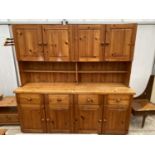 A MODERN PINE KITCHEN DRESSER WITH CUPBOARDS AND DRAWERS TO BASE AND TOP, 84" WIDE