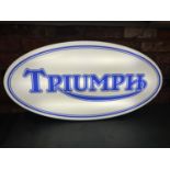 A TRIUMPH ILLUMINATED LIGHT BOX SIGN - WORKING ORDER AT TIME OF CATALOGUING. WIDTH 94CM, HEIGHT