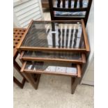 A RETRO NEST OF THREE TABLES WITH SMOKED GLASS TOP