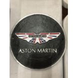 A CAST ASTON MARTIN SIGN DIAMETER 24CM