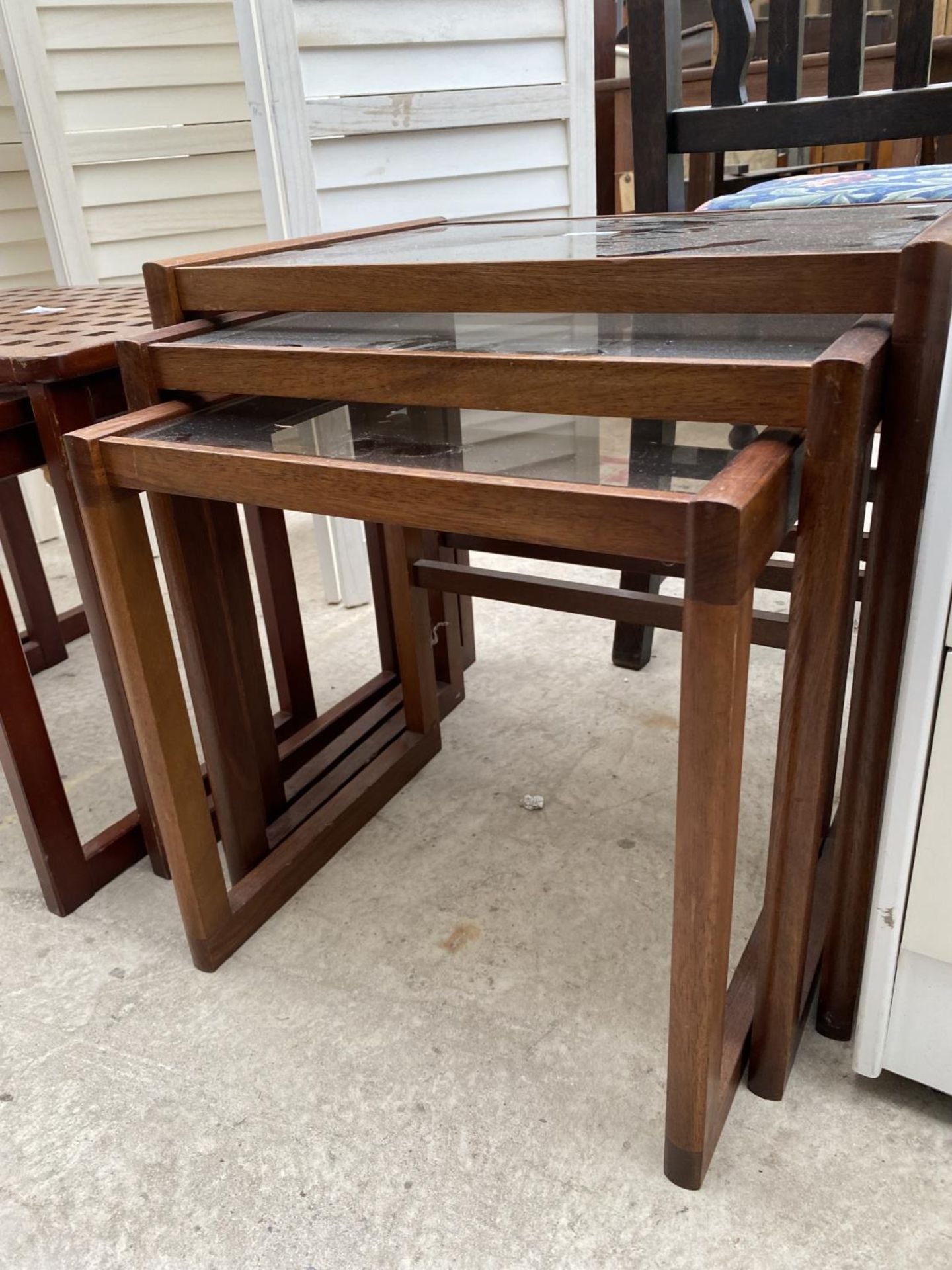 A RETRO NEST OF THREE TABLES WITH SMOKED GLASS TOP - Image 2 of 3