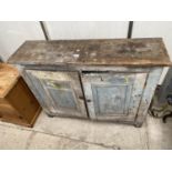 A VICTORIAN PINE PANELLED TWO DOOR CUPBOARD, 43.5" WIDE