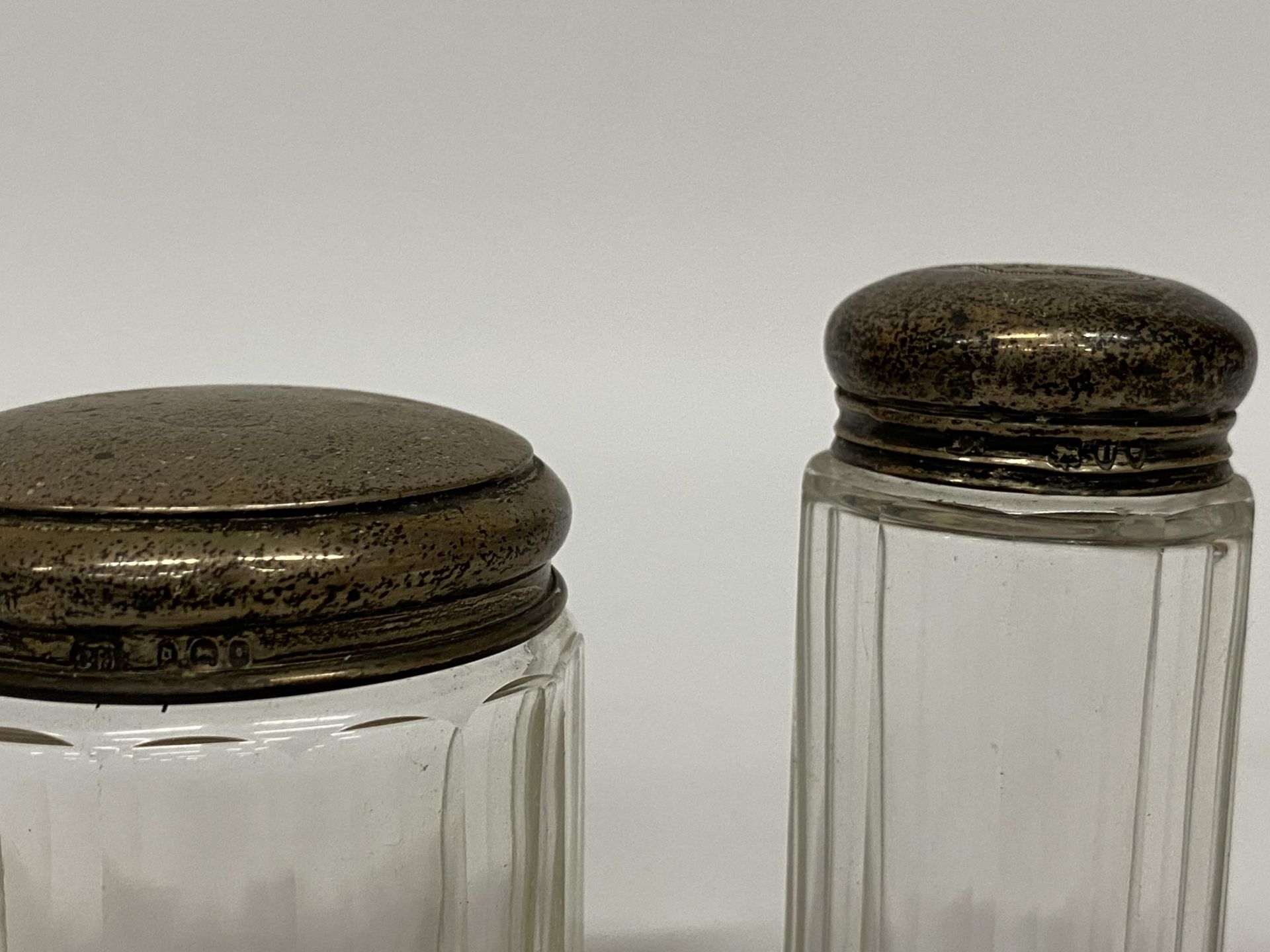 TWO HALLMARKED SILVER TOPPED DRESSING TABLE JARS & FURTHER UNMARKED SUGAR TONGS (3) - Image 2 of 2