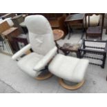 A EKORNES STRESSLESS CREAM SWIVEL RECLINING CHAIR AND STOOL