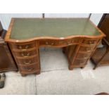 A REPRODUCTION YEW WOOD TWIN PEDESTAL DESK ENCLOSING NINE DRAWERS WITH INSET LEATHER TOP, 45X21"