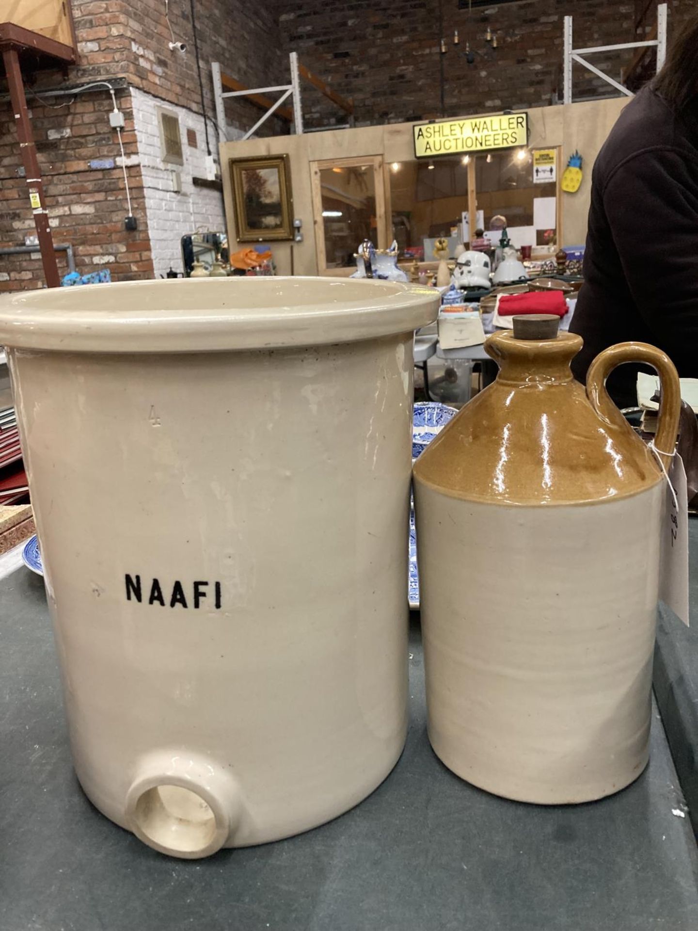 A LARGE NAAFI STONEWARE POT AND A LARGE FLAGON